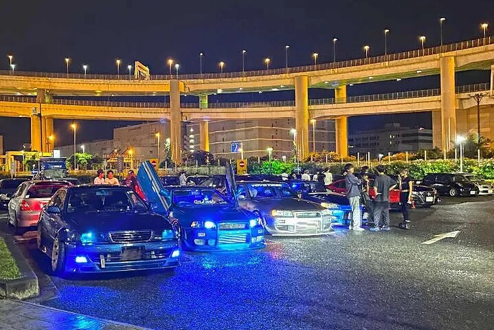 Daikoku Parking Area in Yokohama, the place the organization is named after. Nightly, self-organising, and with no entity behind it. New York does not allow that version, which is the whole starting problem