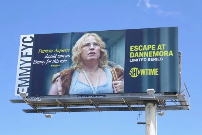 The same frame at eighty feet. On a billboard the quote is sized for someone driving past it, and the category line sits where a voter scanning at speed will find it